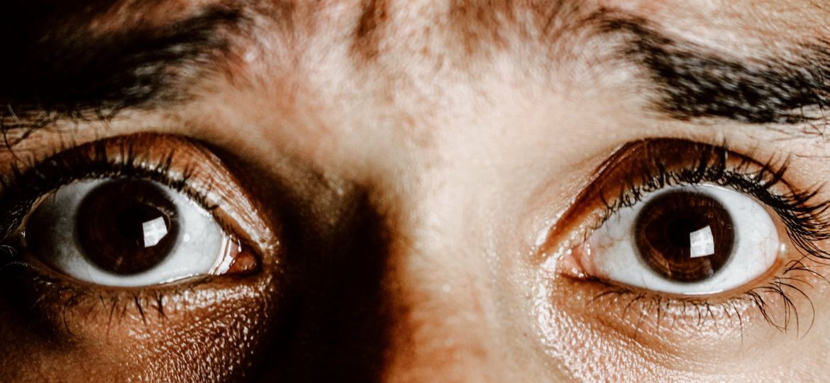 extreme close up photo of frightened eyes