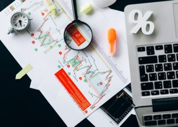 magnifying glass on white paper