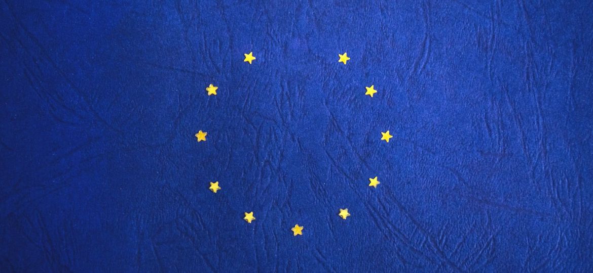 blue and yellow round star print textile