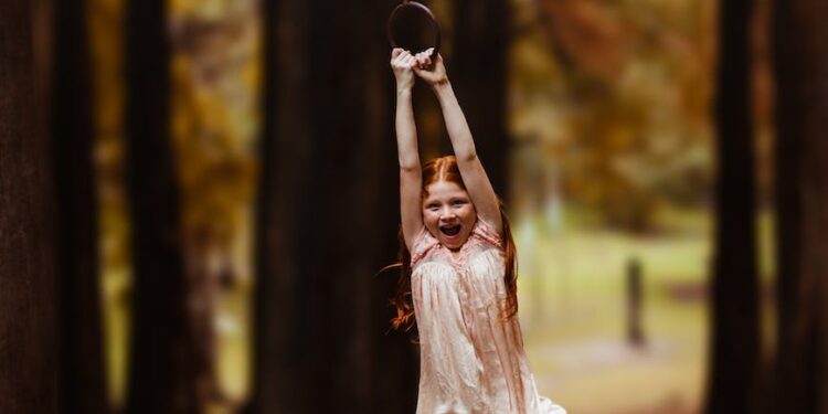 girl hanging on swing