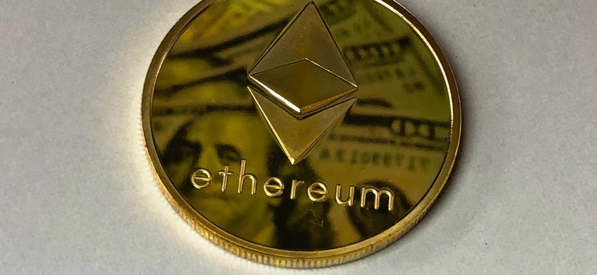 round gold colored ethereum ornament