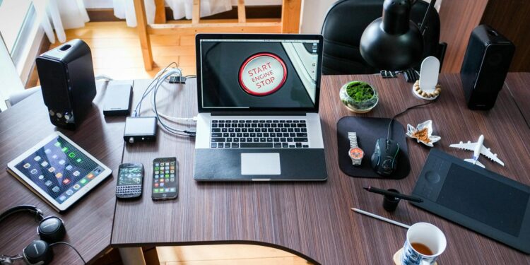 black and white laptop computer on brown wooden desk