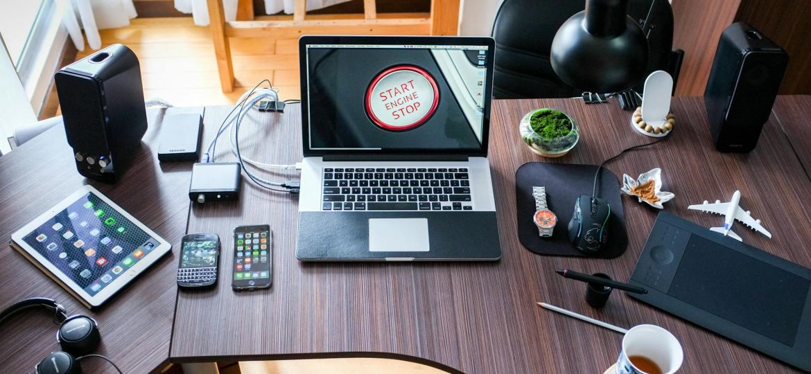 black and white laptop computer on brown wooden desk