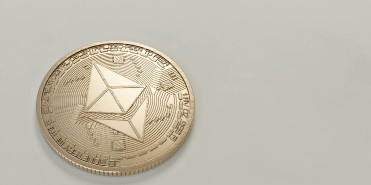 round gold colored ethereum coin